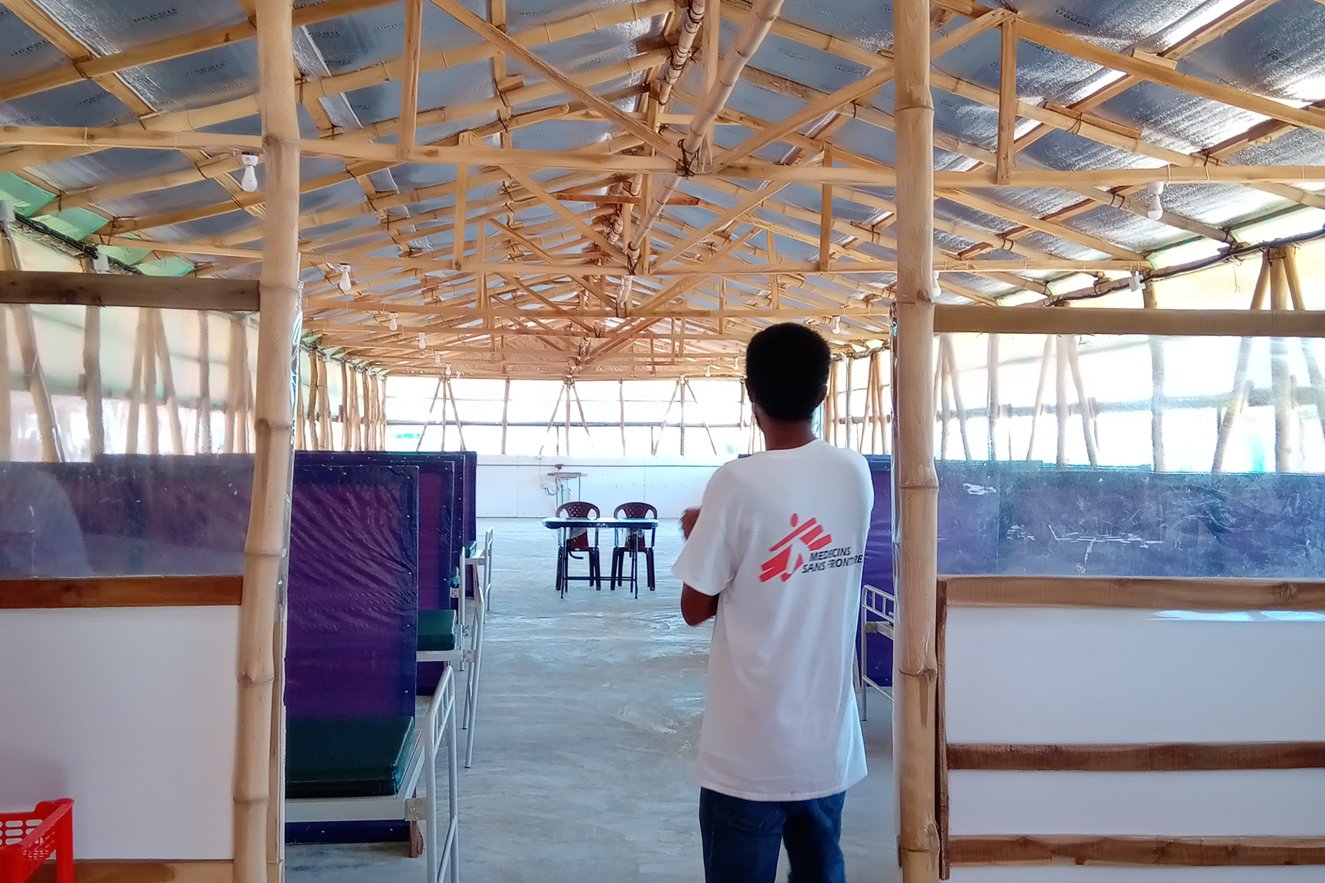 A staff member stands in front of the ward at the MSF COVID-19 isolation and treatment centre in the Nayapara refugee camp, Bangladesh. © MSF