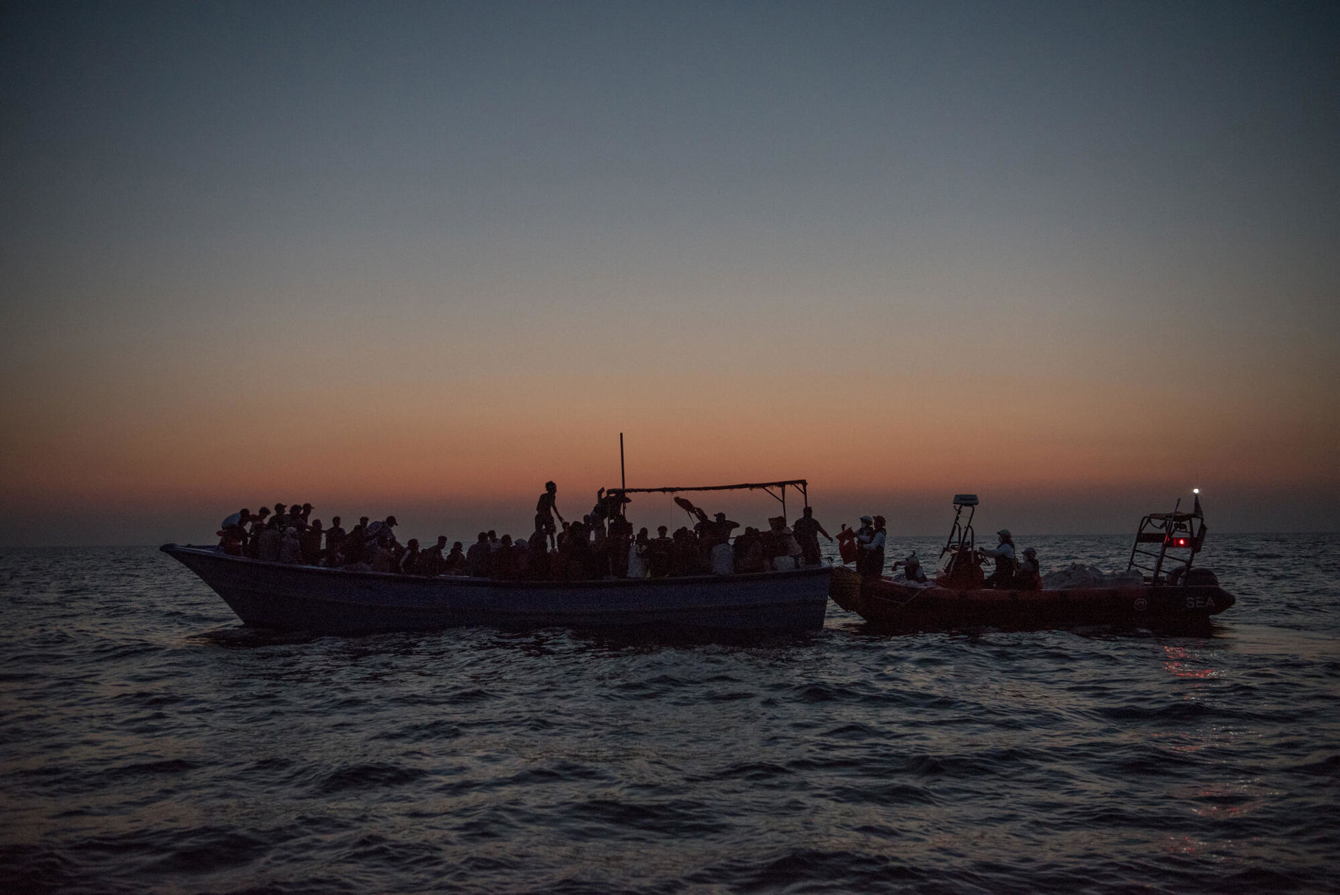 Geo Barents, in a night rescue of 188 people from an overcrowded wooden boat (Taken at August 15, 2021). © Vincent Haiges