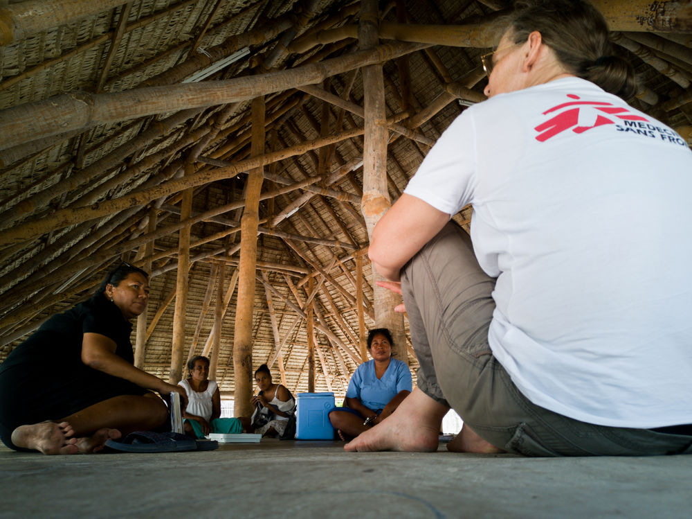 MSF project medical referent and midwife, Sandra Sedlmaier-Ouattara talks with Antje Reiher Tebwana, NCD public health specialist with the Kiribati Ministry of Health and Medical Services (left), and nurse Teraitinikarawa Reti (in blue) in Tabituaea North, on the outer islands of Kiribati. © Manja Leban/MSF