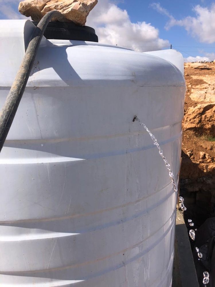 Water tanks with bullet holes, caused by settlers shooting at homes, herd, and water tanks, according to the community in West Bank. © MSF